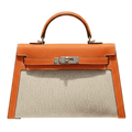Hermès | Kelly Bag In Orange Leather And A Neutral Canvas Material